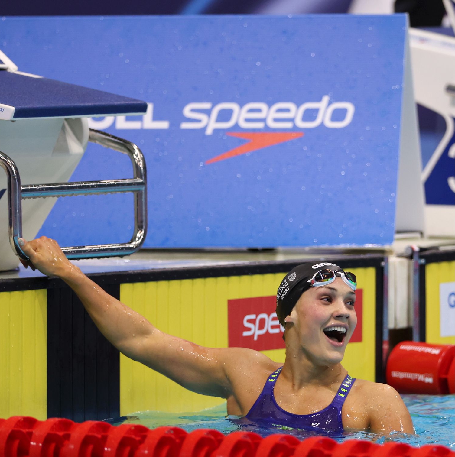 Angharad Evans celebrating victory in the pool