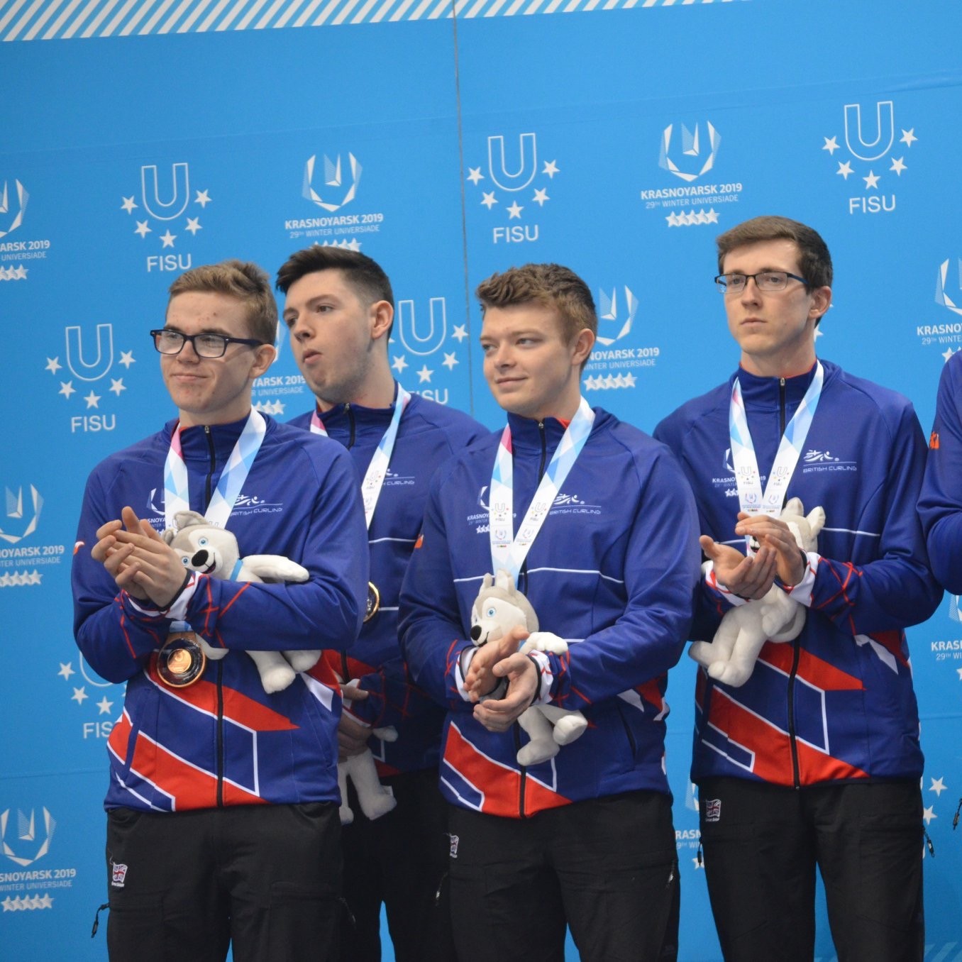 Ross Whyte (far left) impressed as men's skip in Russia.